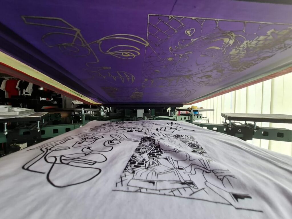 Detailed shot of a single-colour print on white t-shirts