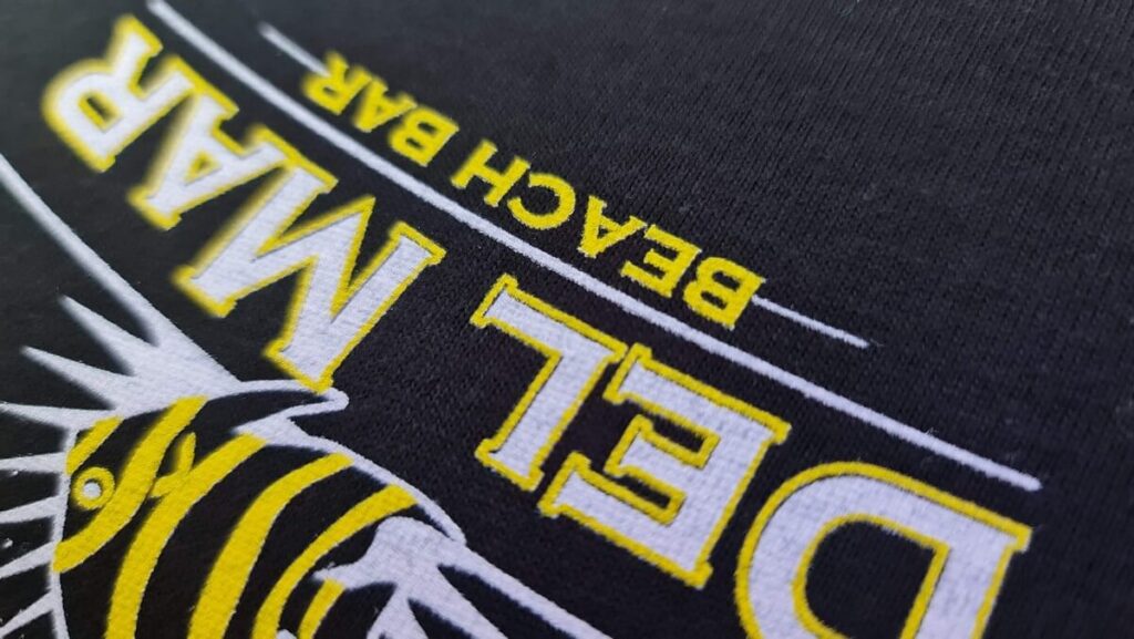 Close-up details of t-shirt prints for Beach Bar Del MAR
